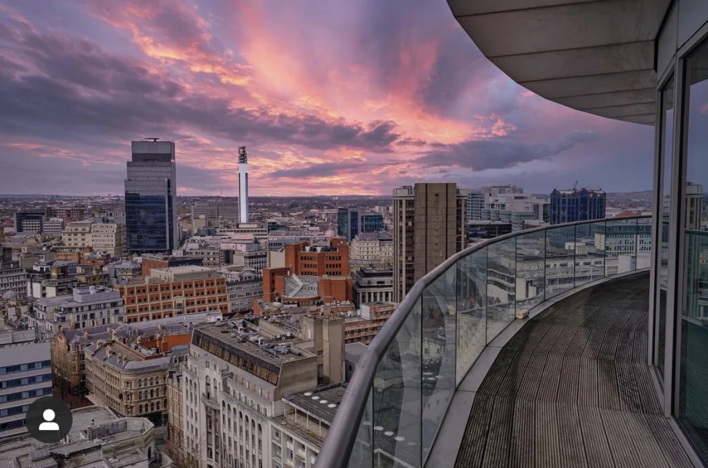 Birmingham city views at dusk from the top of Staying Cool's apart hotel at Rotunda