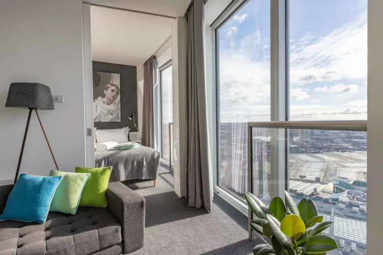 Staying Cool clubman apartment living space and first bedroom with stunning city views