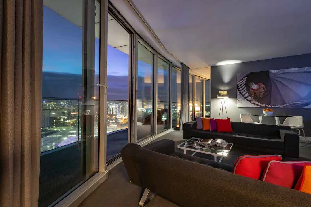 Staying cool's penthouse living space and wrap around balcony at night