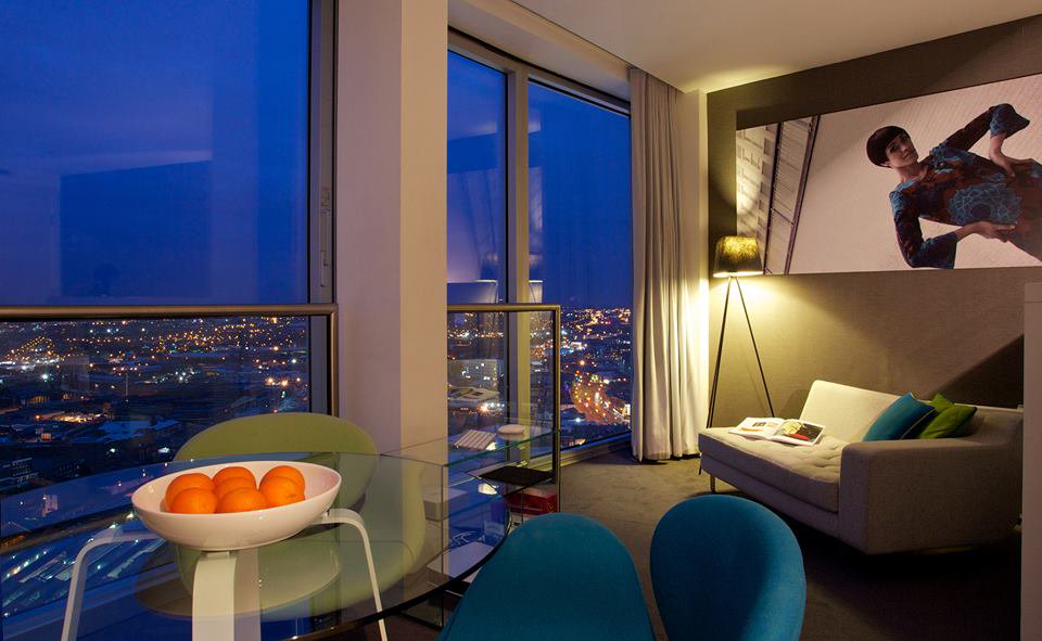 Mini studio apartment by night at Staying Cool Birmingham with view over city, 