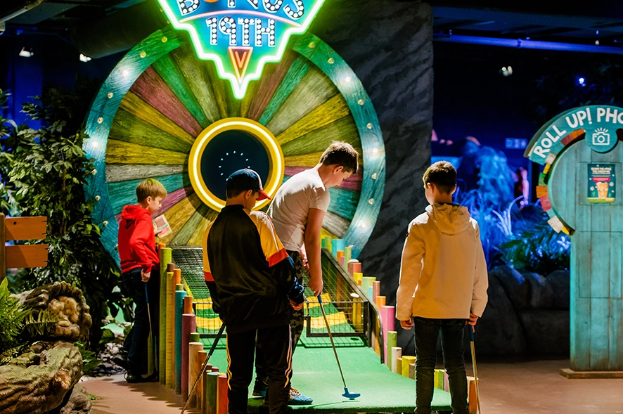 Children playing miniature golf at Treetop Adventure Golf in Birmingham