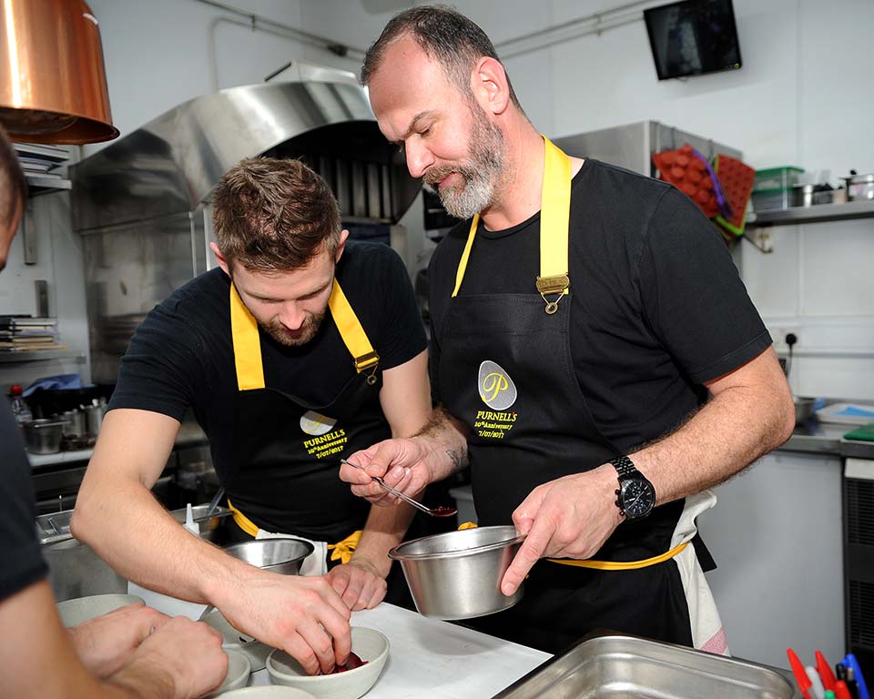 Chef Glynn Purnell in the kitchen with his team