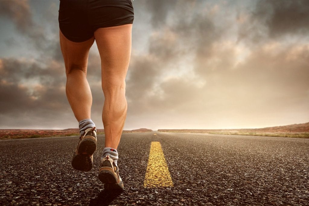 Image of person running down an empty road