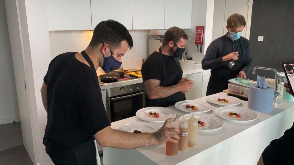 Wilderness chefs prepping dishes in penthouse