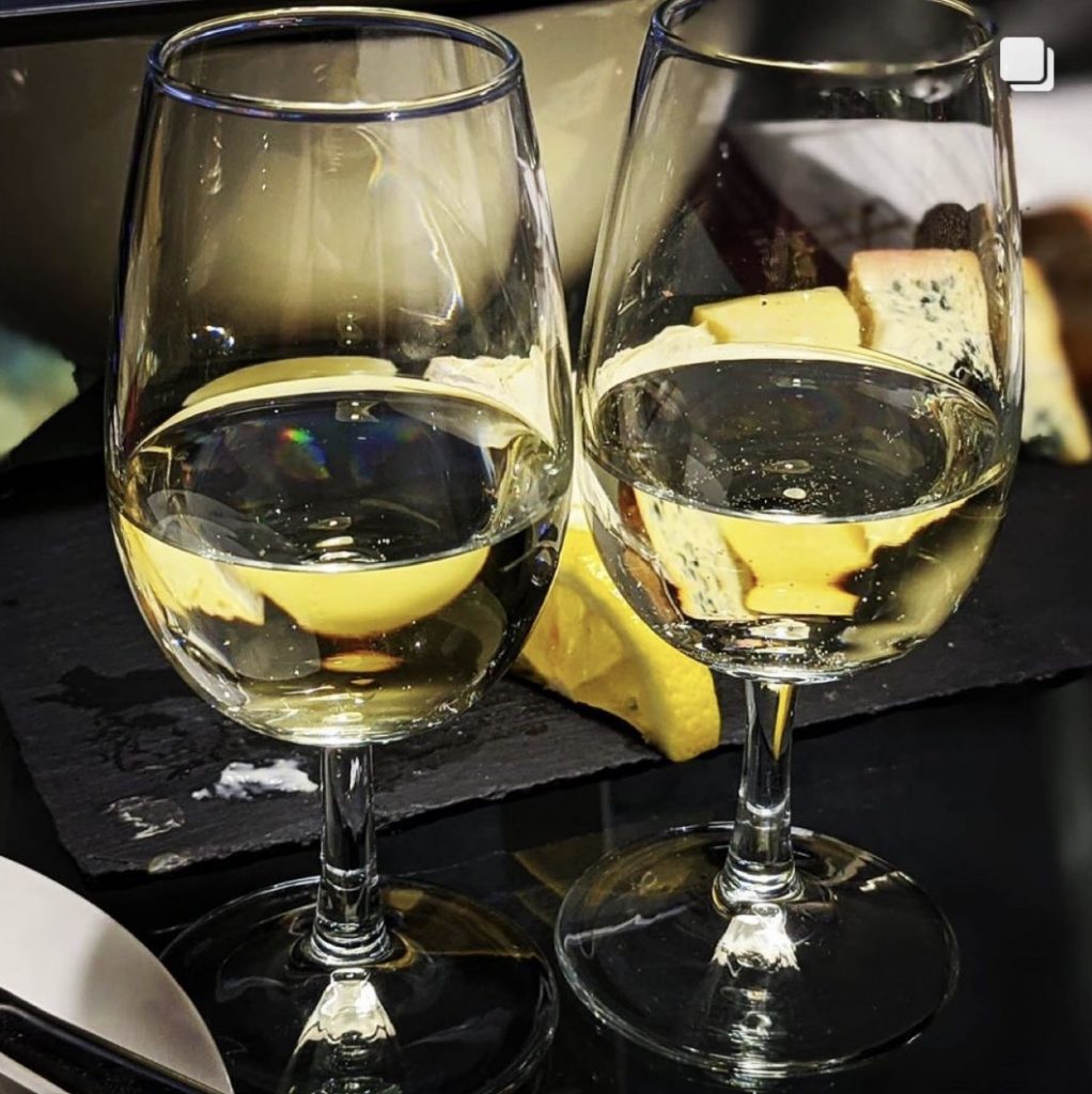 Two glasses of white wine from the Wine Staycation event at Staying Cool's Rotunda Aparthotel
