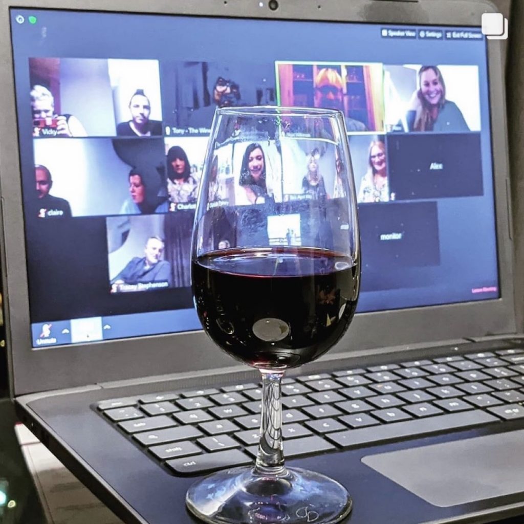 Red wine in front of a Zoom conversation at the Wine Staycation event at Staying Cool's Rotunda Aparthotel