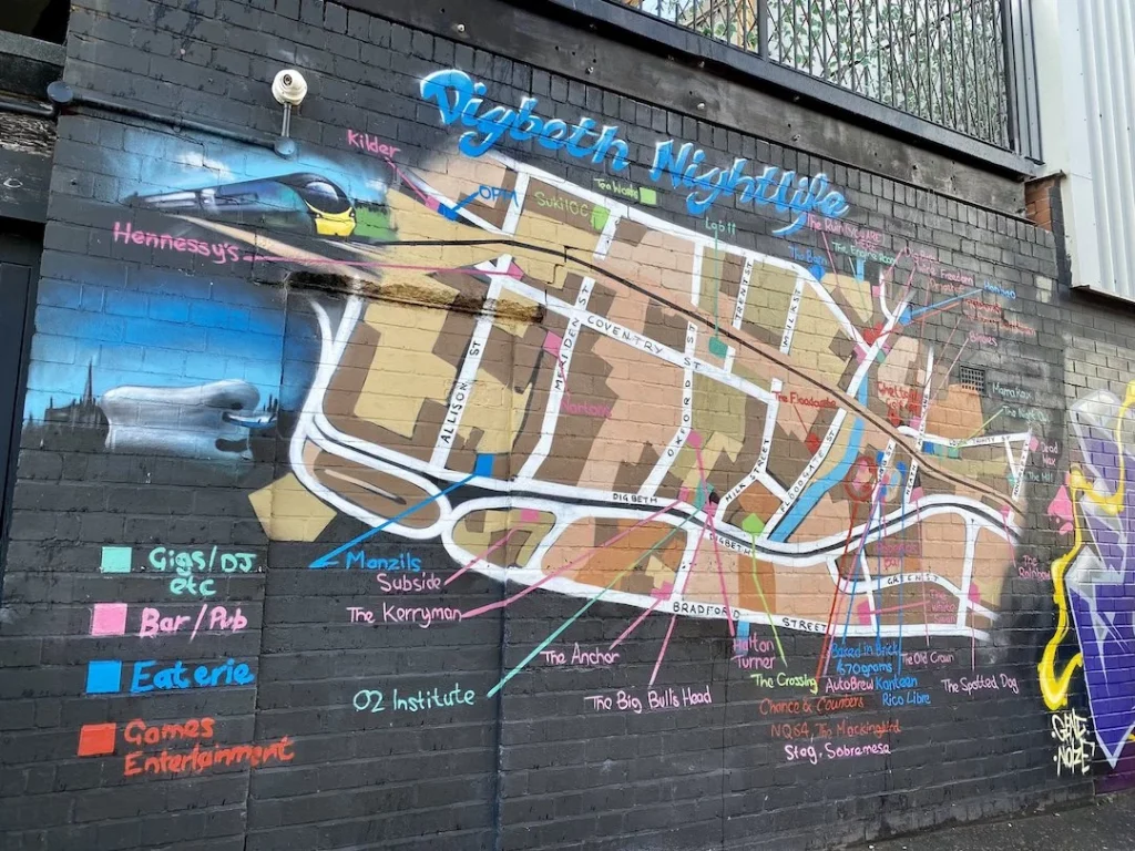 A map of Digbeth nightlife venues in Birmingham spray painted onto a  brick wall.