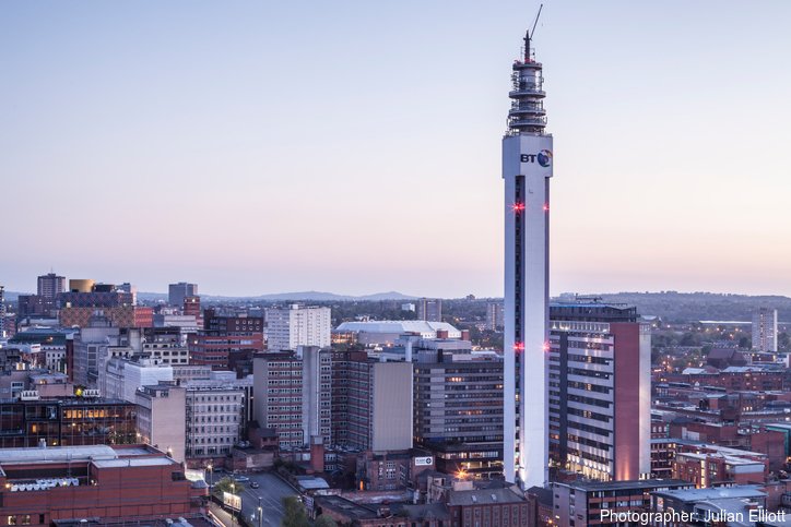 View over Birmingham city centre at dusk, with landmark buildings and the BT Tower. Photographer: Julian Elliott