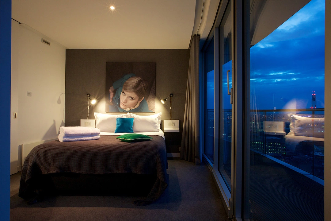 Staying-Cool-at-the-Rotunda-Penthouse-Bedroom-View-at-Dusk