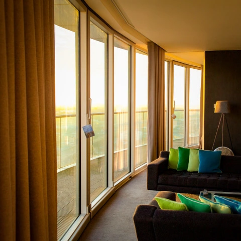 Golden hour inside Staying Cool's top floor penthouse at Rotunda. Visit our Staying Safe guest guide to learn more about how we're keeping Rotunda covid secure.