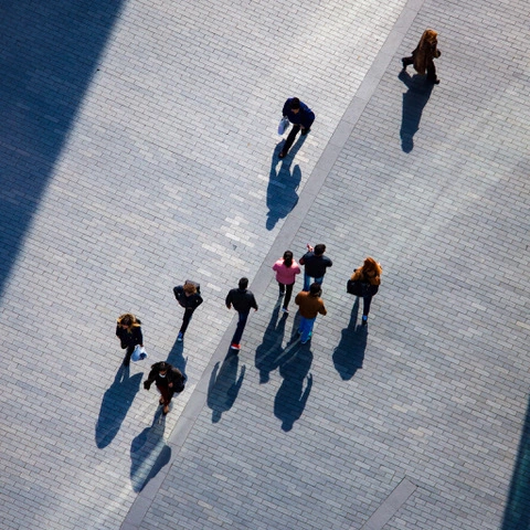 Looking down at pedestrians from the floor to ceiling windows of your staying cool apartment