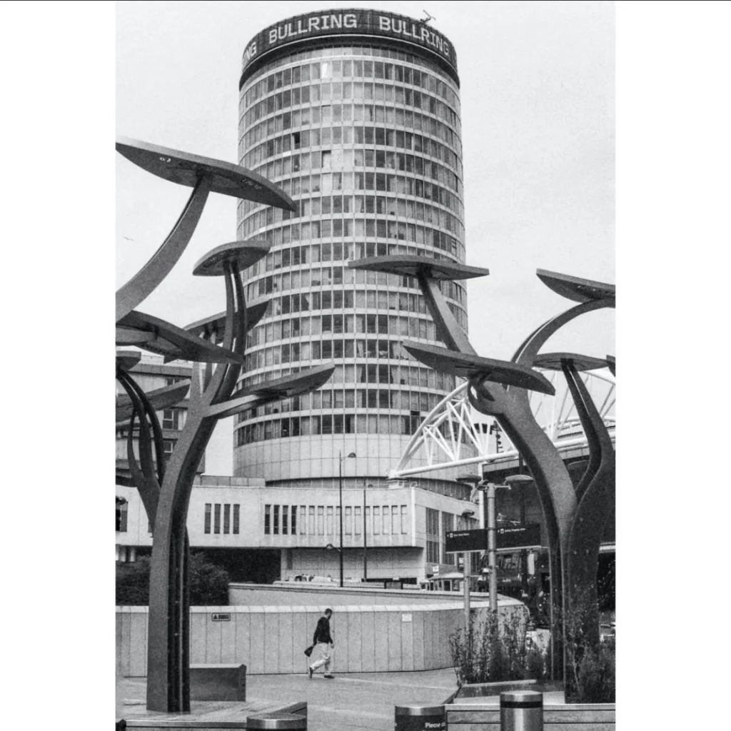 Staying Cool's Rotunda apart hotel and the Birmingham pub bombings memorial by Anuradha Patel in black and white taken by @emedem